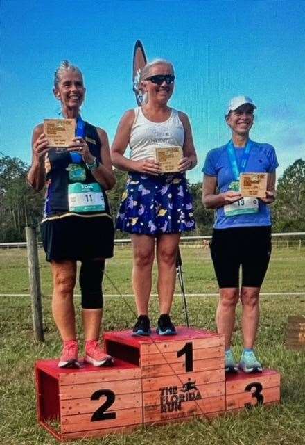 Alice Ingman, left, on the podium in Florida