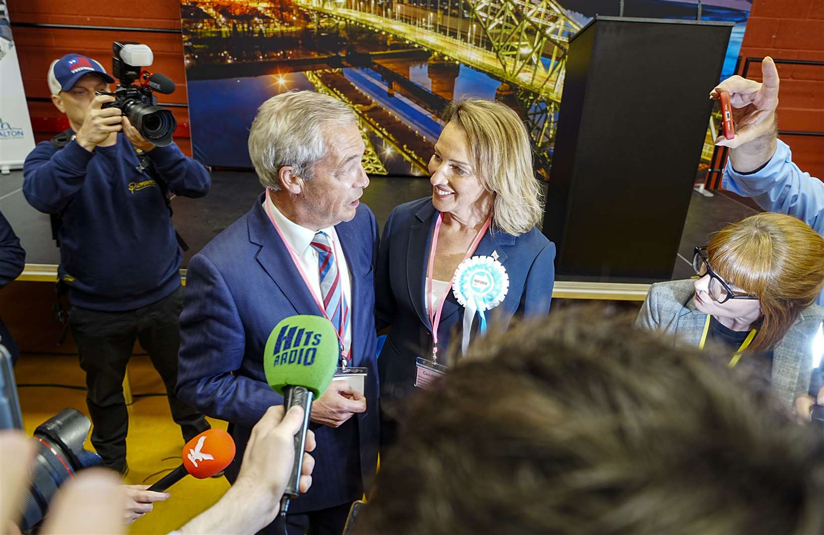 Reform UK’s Sarah Pochin and party leader Nigel Farage speak to the media (Peter Byrne/PA)