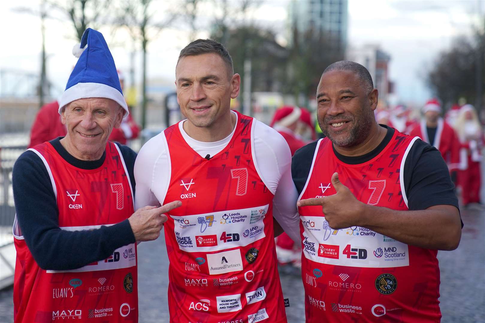 Kevin Sinfield with Peter Reid (left), John Barnes (right) before he starts his latest fundraising challenge, Running Home For Christmas (Peter Byrne/PA)