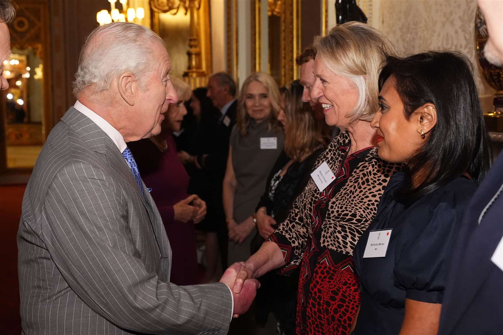 Charles greeted Sally Taylor, the longest-serving BBC news presenter (Aaron Chown/PA)