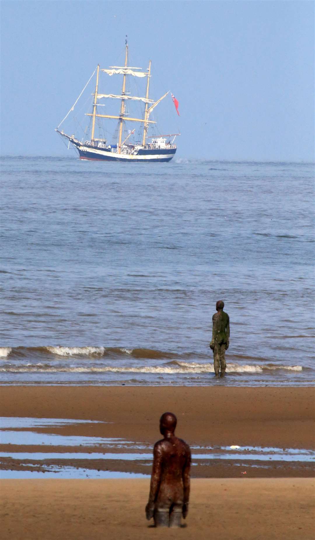 The beach is famous for Antony Gormley’s Another Place installation (Peter Byrne/PA)
