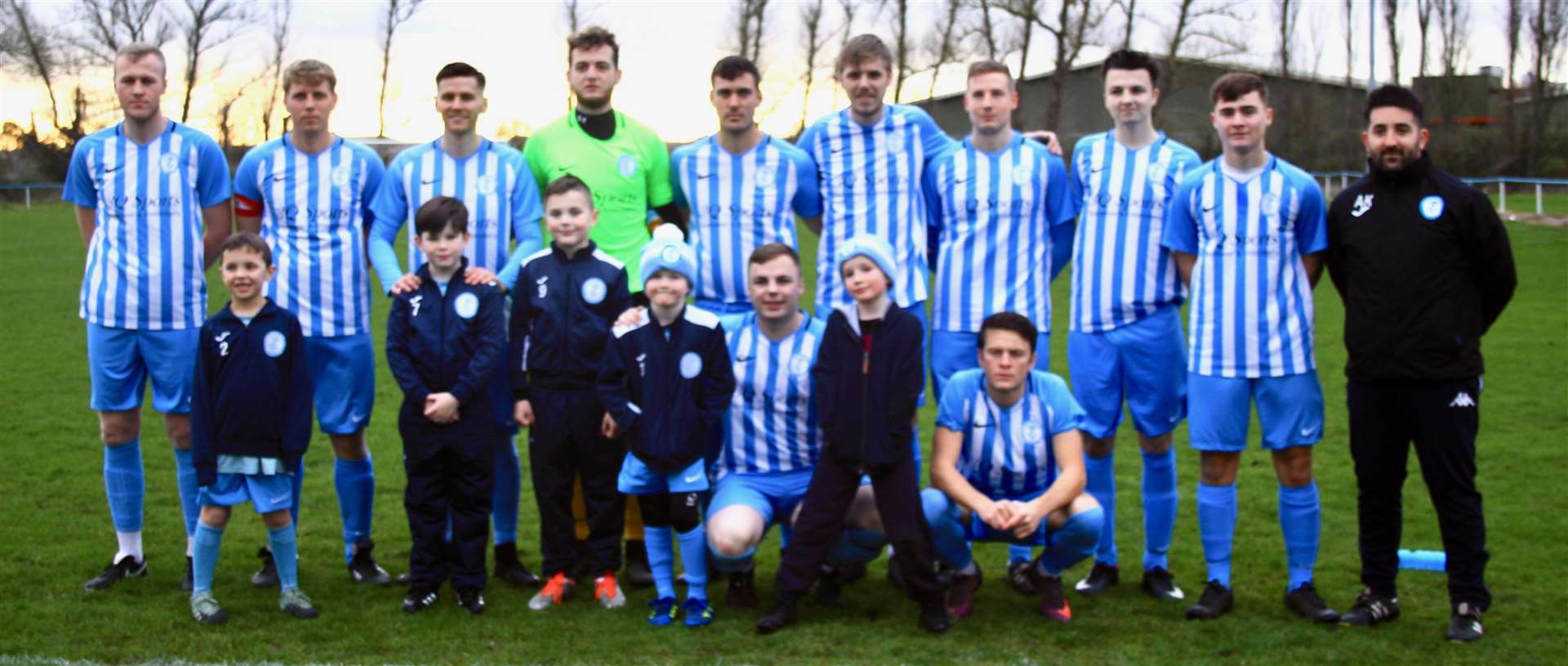 Chatteris Town - First Team 2018-19 (Back, from left: Ash Blanchflower, Simon Howard, Gary Smith, Jordan Packi, Stuart Porter, Ben Matthews, Scott Fisher, Mark Rayment, Brandon Ransome, Alex Kaufman)(Front, from left: Josh Dodman with Chatteris Town Young Lilies Under 8’s mascots, Jack Saunders. (6492426)