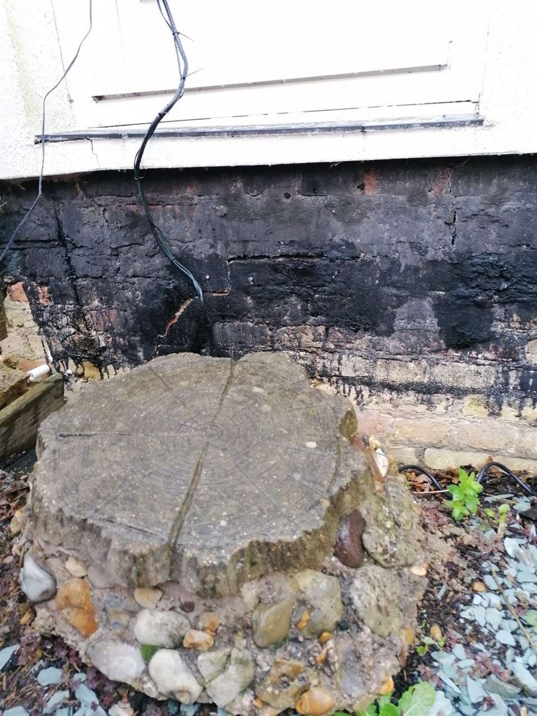 This stone used to be more or less level with the front door, now it is a good 8 inches lower. (43350653)