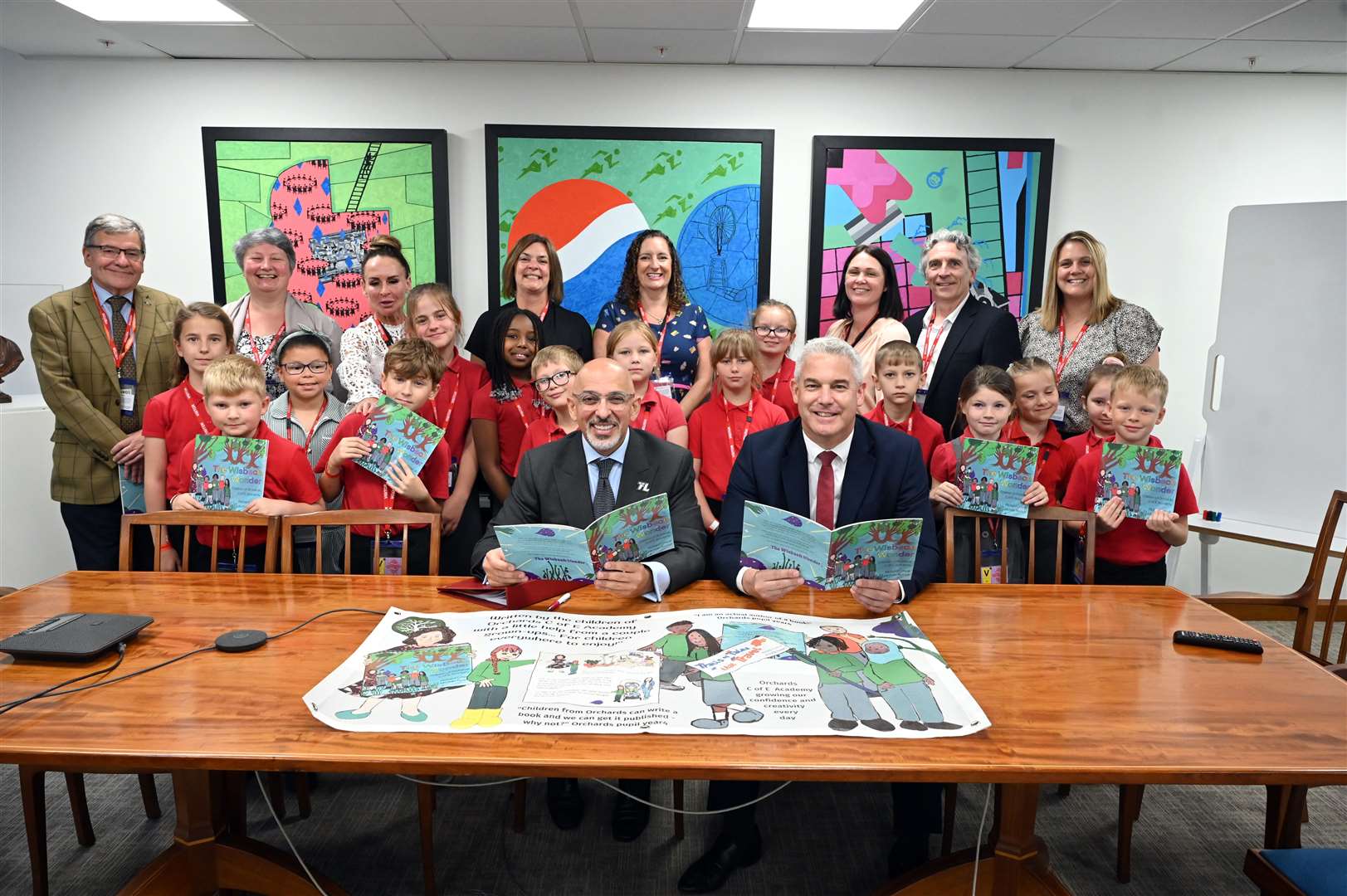 Orchards School visit to Department of Education to show the Secretary of State for Education Nadhim Zahawi a book that has been produced by the school. (57446759)