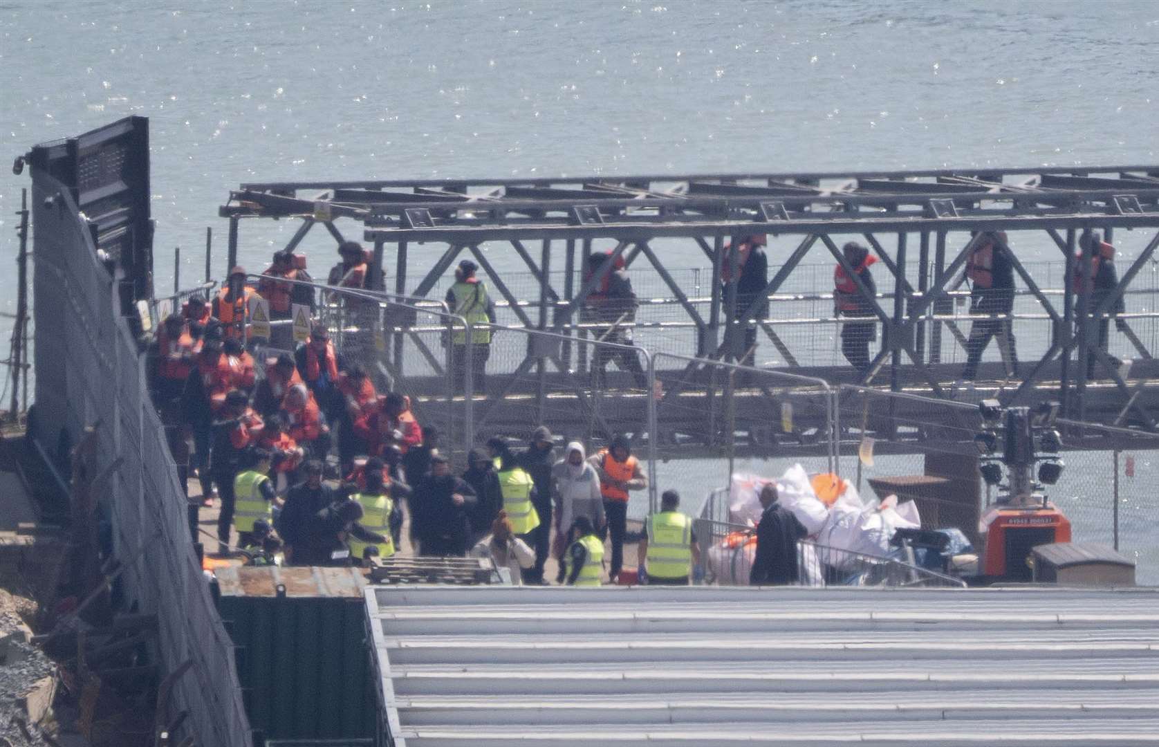 A group of people thought to be migrants being brought in to Dover, Kent, by Border Force on Tuesday following a small boat incident in the Channel (Gareth Fuller/PA)