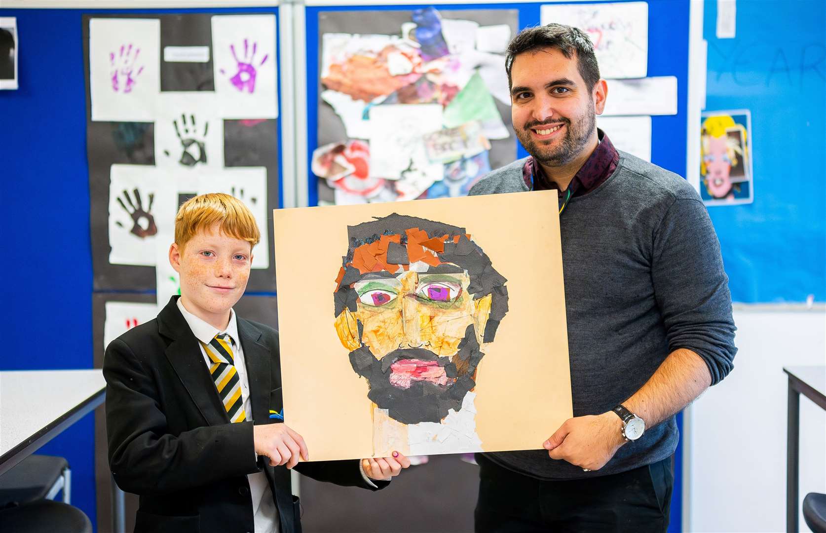 Teacher Sam Ross and one of the students with his artwork. Photo: Ian Burt/Barking Dog Media.