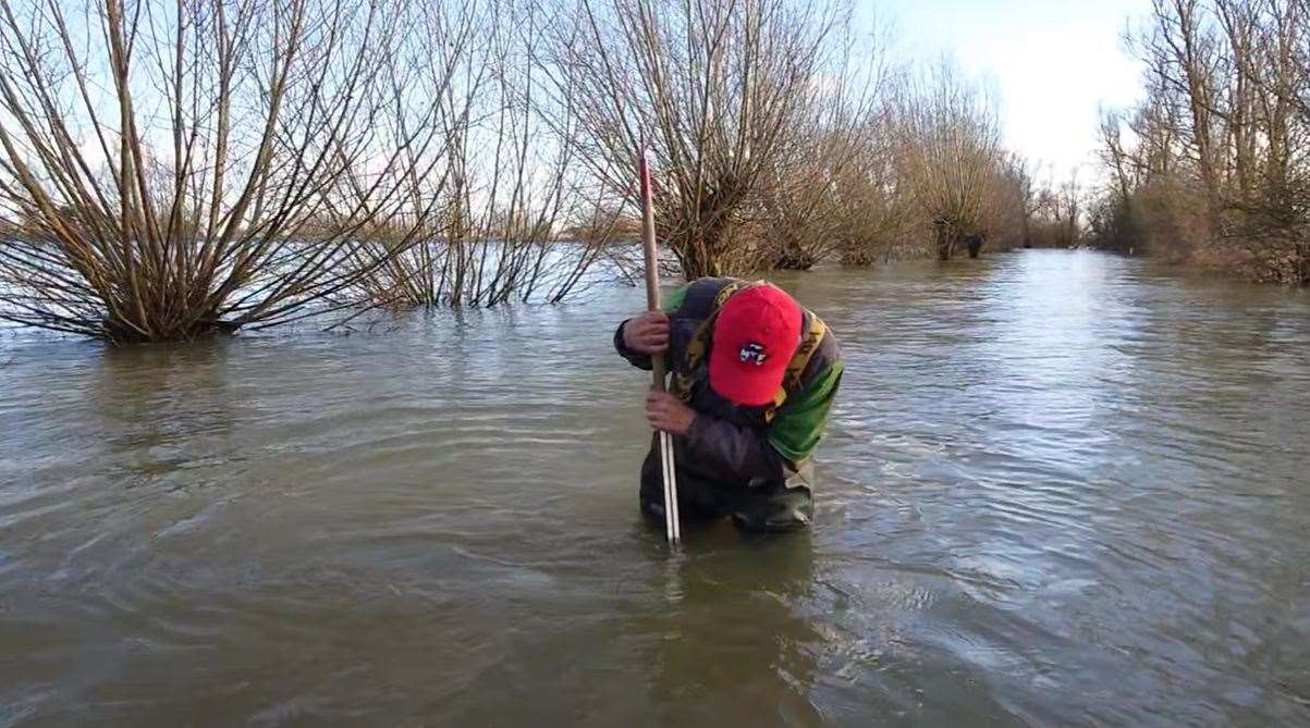 Ken Goodger wading in Welney Wash on February 12 2024. Picture: SWNS