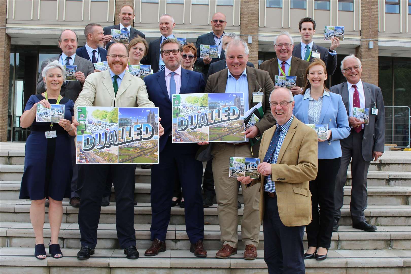A47 Alliance Chairman Martin Wilby (front) with members of the alliance on the steps of County Hall in Norwich including (front row, left to right): Alison Thomas, Deputy Leader of Norfolk County Council; George Freeman, MP for Mid Norfolk; James Palmer, Mayor of Cambridgeshire and Peterborough; Richard Bacon, MP for South Norfolk; and Nova Fairbank, Public Affairs Manager for Norfolk Chamber of Commerce. (2030820)