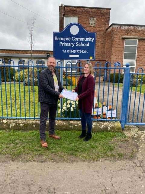 Tara Rust hands the petition to county councillor Chris Dawson on behalf of the Upwell and Outwell parents