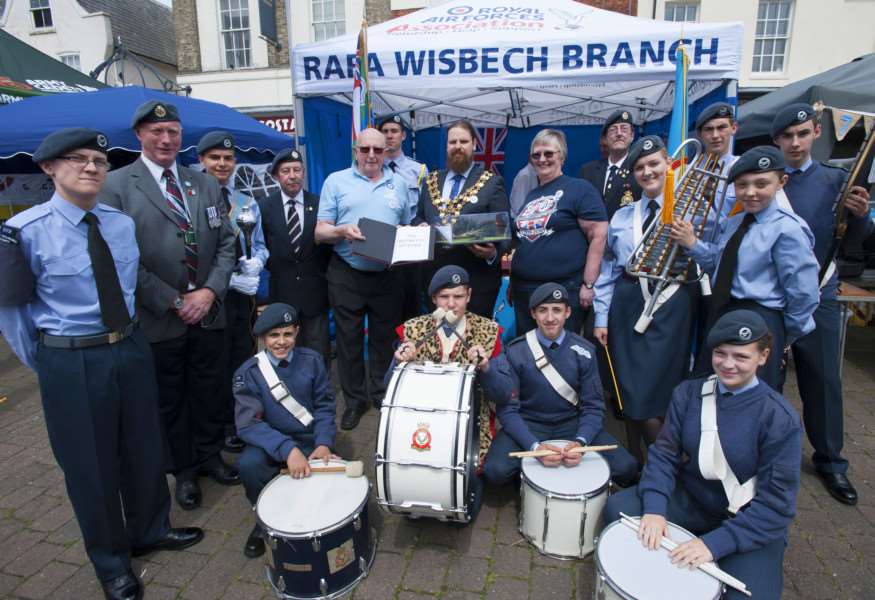Armed Forces Day. Wisbech Market Place. Pictured Wisbech Town Mayor Garry Tibbs presents model Spitfire ANL-160619-191245009