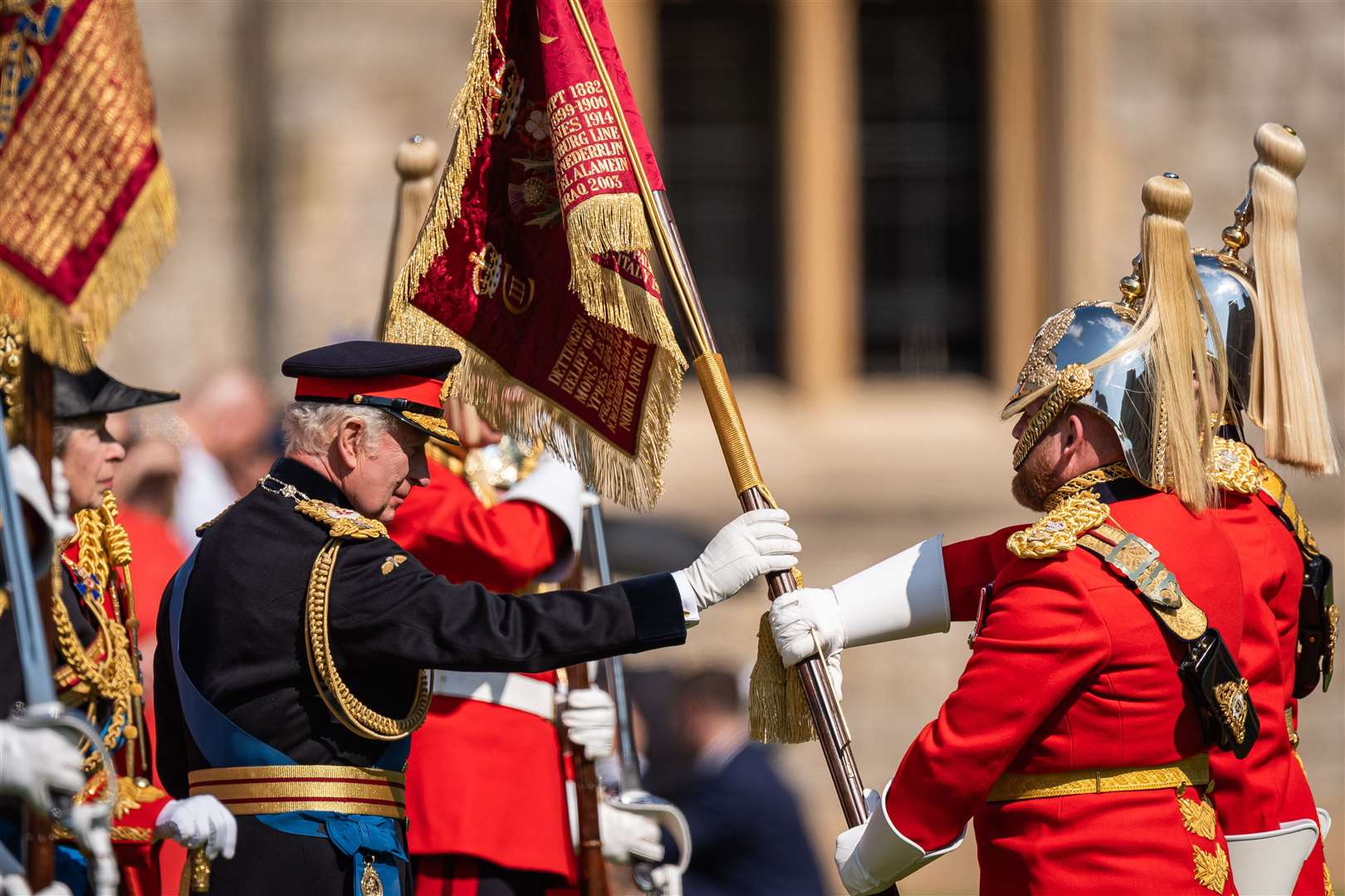 Charles symbolically touched the new standards during the ceremony (Aaron Chown/PA)