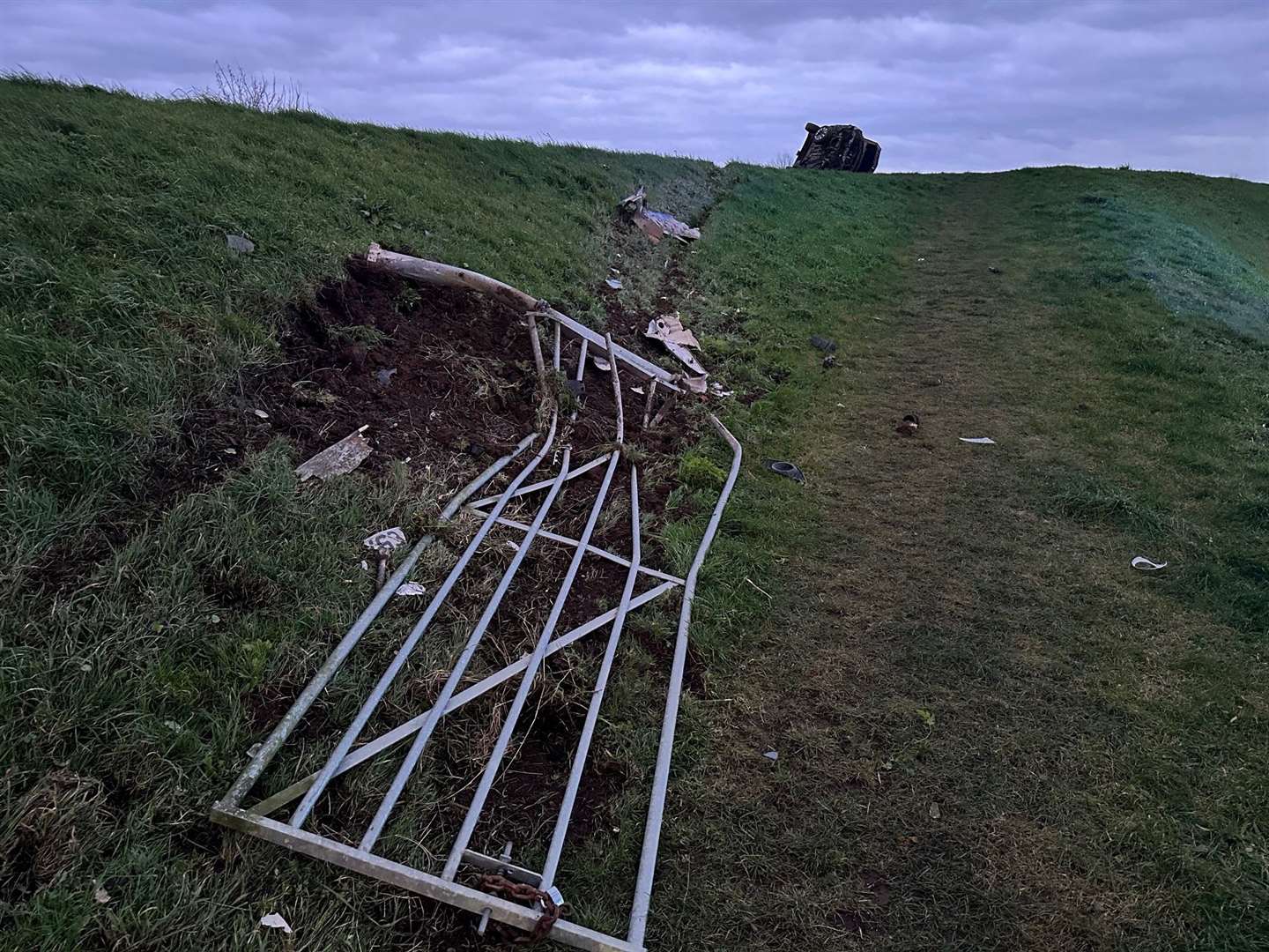 The trail of devastation - this gate and its concrete posts were credited with stopping the car from entering the water after the crash in Guyhirn.