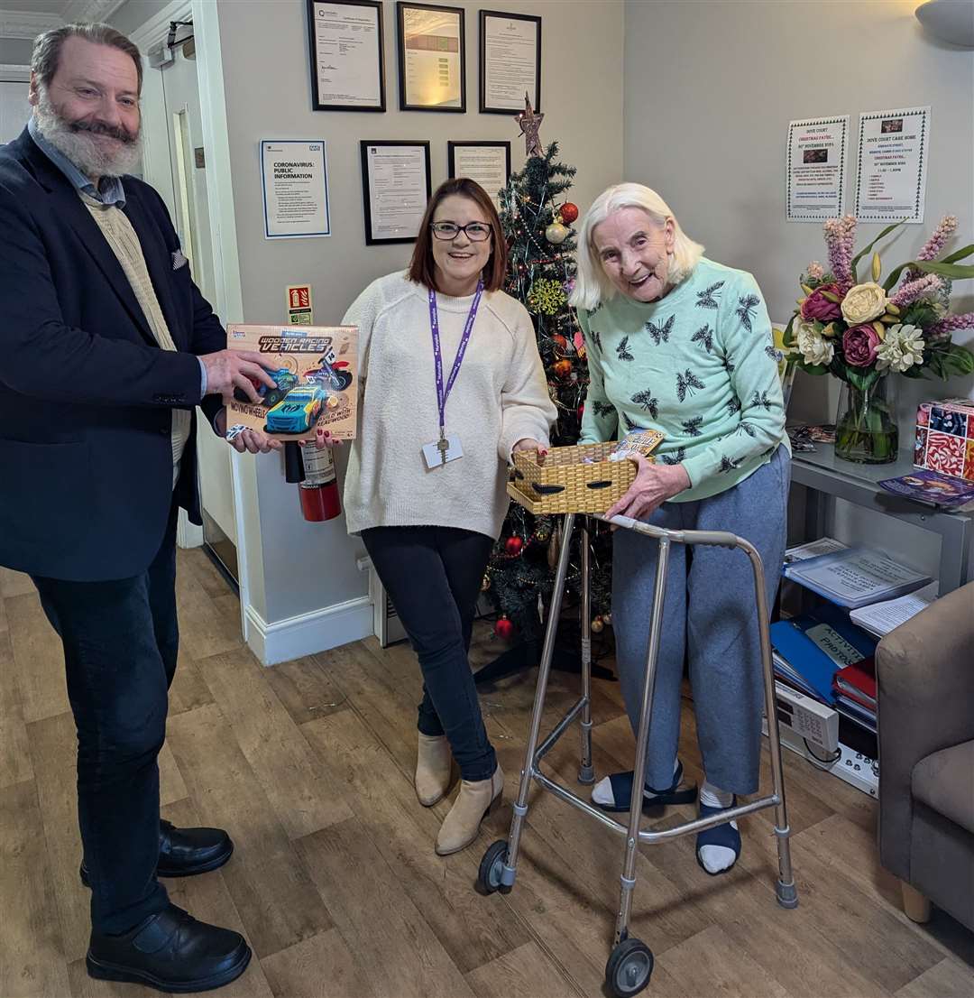 Residents Doris Clayton and Allan Baldwin start handing over items to a representative of Nurseplus
