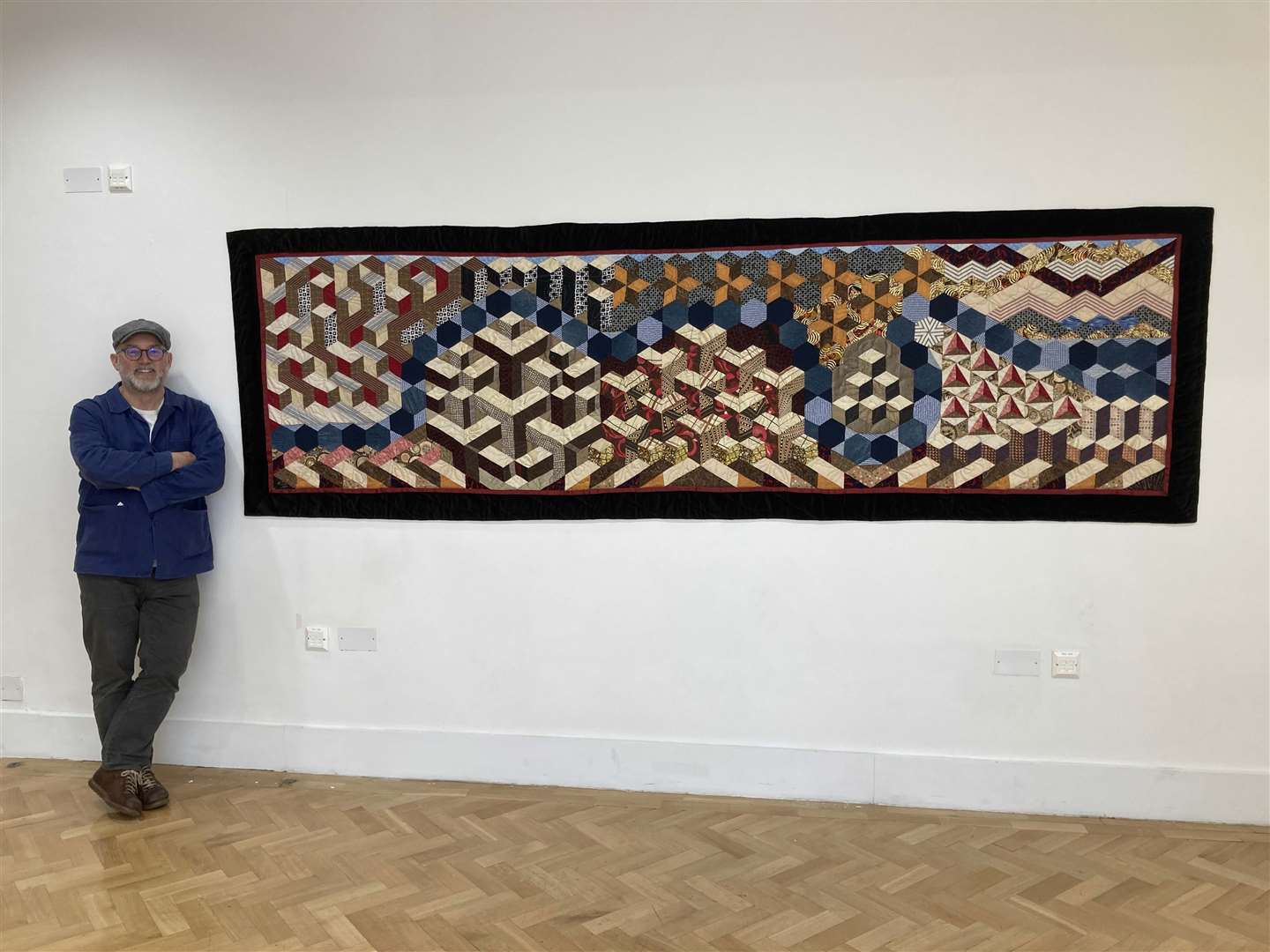 Richard Kenyon with a River Thames quilt, which is separate from the Covid quilting project (Richard Kenyon/Henrietta Hill/PA)