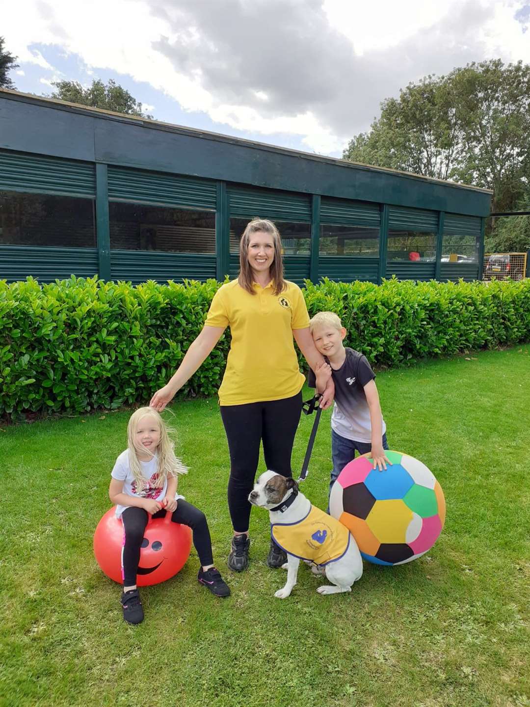 Bonzai with his new owners, Emma, Jack and Maisie. (42301367)