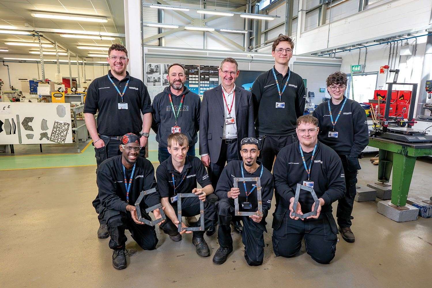 Principal David Pomfret and lecturer Darren Freeman with Wisbech-based Mechanical Engineering students Charley Giffen, Ryszard Mydlowski, Harry Brice, Tiago Hissengo, Harry Raven, Taran Lally, and Harvey Wright. Picture: College of West Anglia