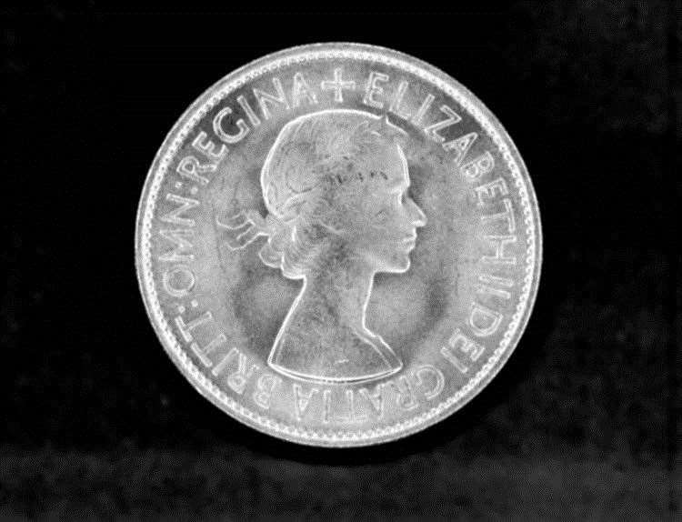 The obverse of the half-crown piece minted in 1953, after Queen Elizabeth II’s accession the previous year, portraying as a young woman in her mid-20s (PA) (59679036)