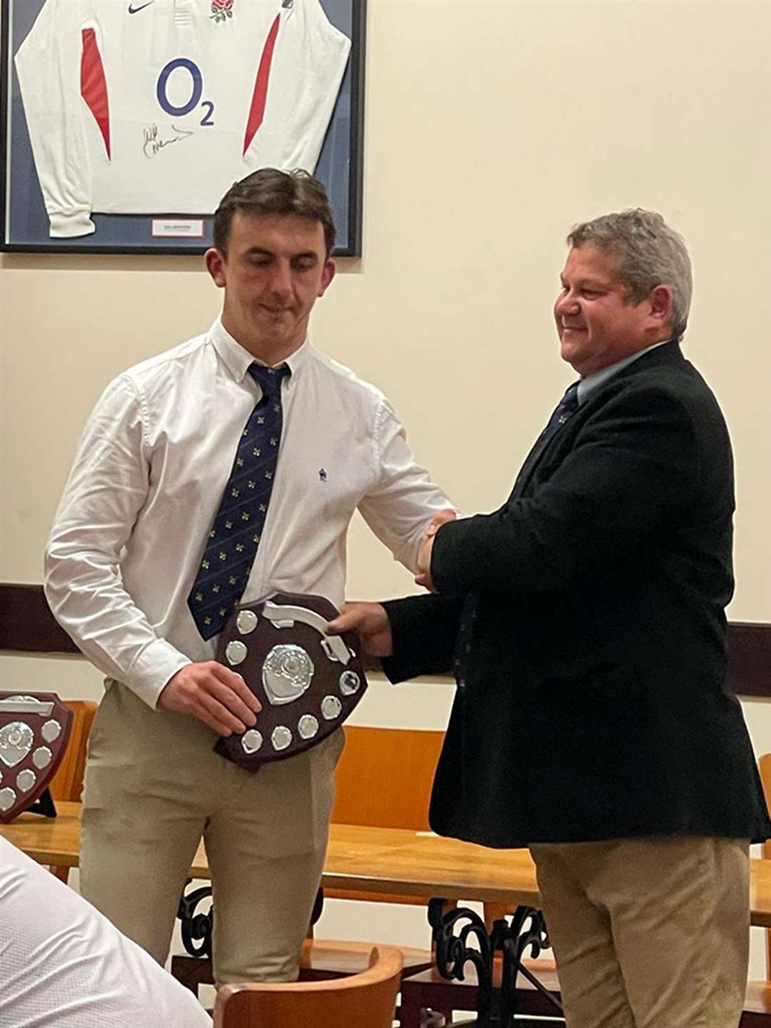 Back row Bradley Williams collect the Club person of the Year on behalf of the 1st XV and every player who pulled on a red shirt this past season for the club and town