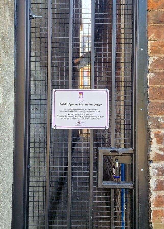 A passageway has been blocked by locked gates to stop anti-social behaviour.