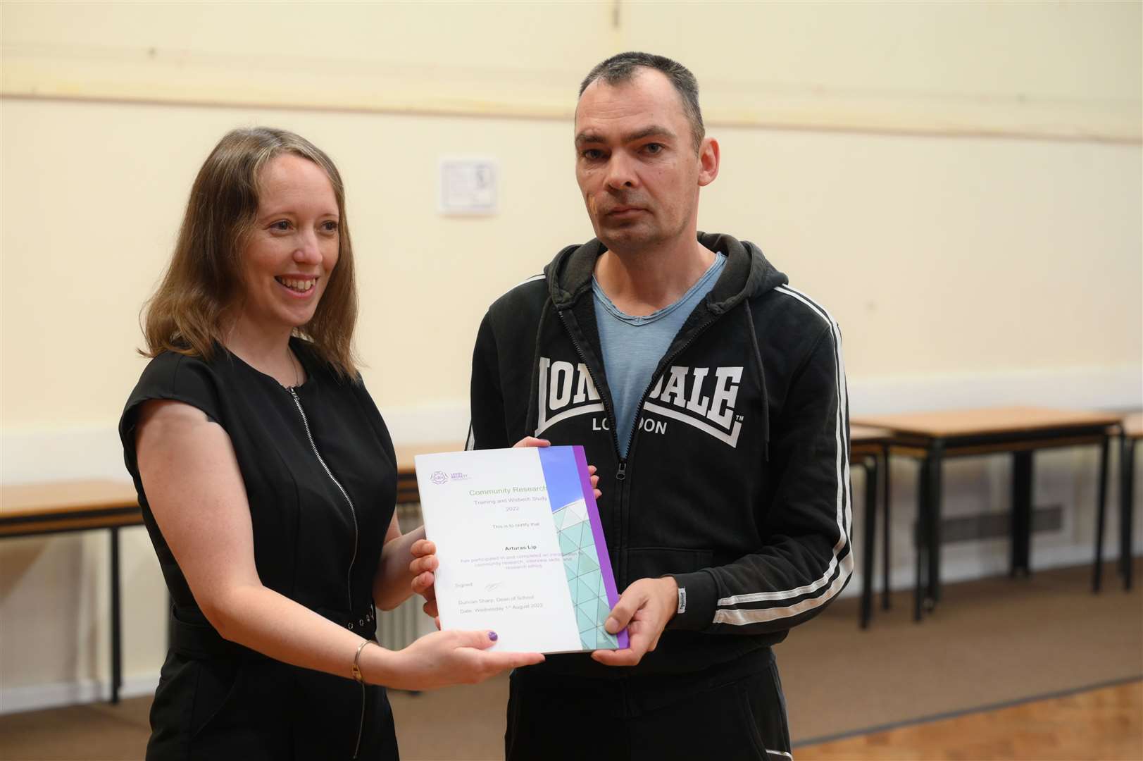 Arturas Lip was among the research group and received his certificate from Susan Coan.