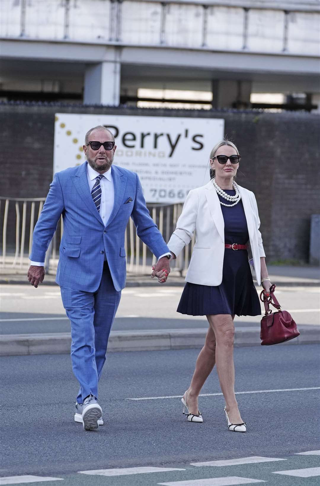 Derek Hatton, who was deputy leader of Liverpool council in the 1980s, arrives with his wife Sonjia Hatton at Preston Crown Court (Peter Byrne/PA)