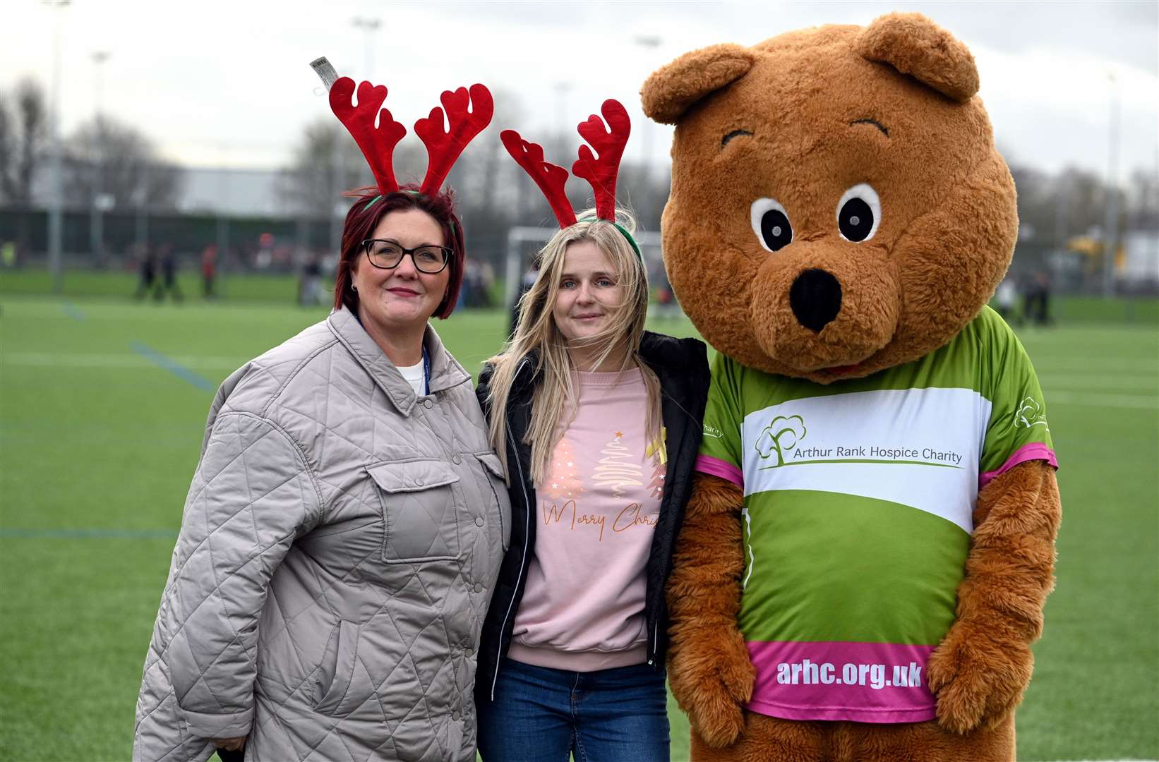 Toni Bird (left) with one of the runners and Arthur the Bear