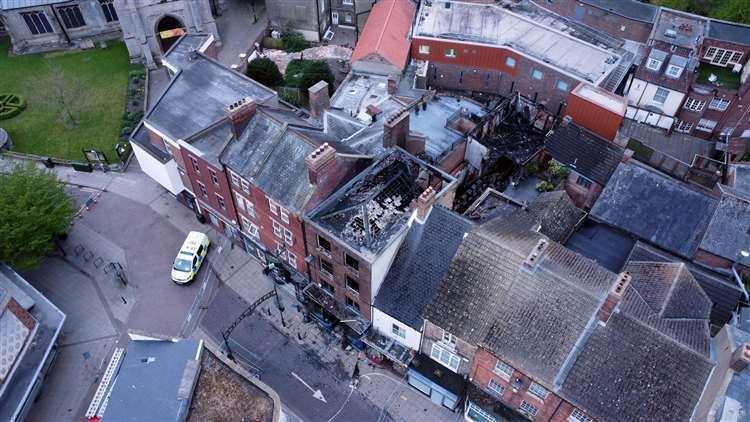 A total of eight crews plus an aerial appliance were called to deal with the fire which broke out on the evening of April 22 2022 and saw flames shooting from the shop front and left the building gutted as shown in this image by photographer Adam Fairbrother.