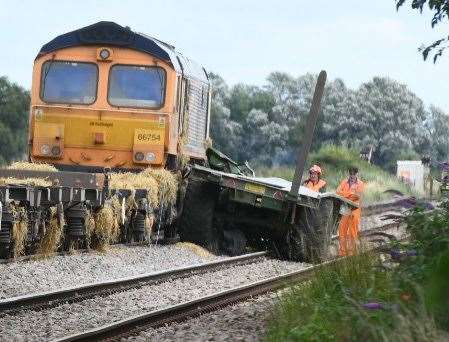 Network Rail staff work to clear the track at March on the day of the crash