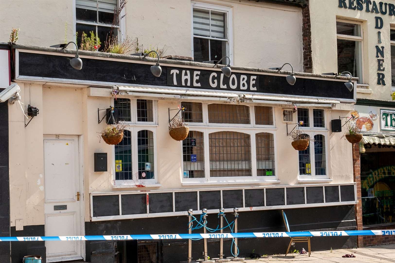 The area around The Globe in Wisbech's Market Place has been taped off today. Pictures: Michael Fysh