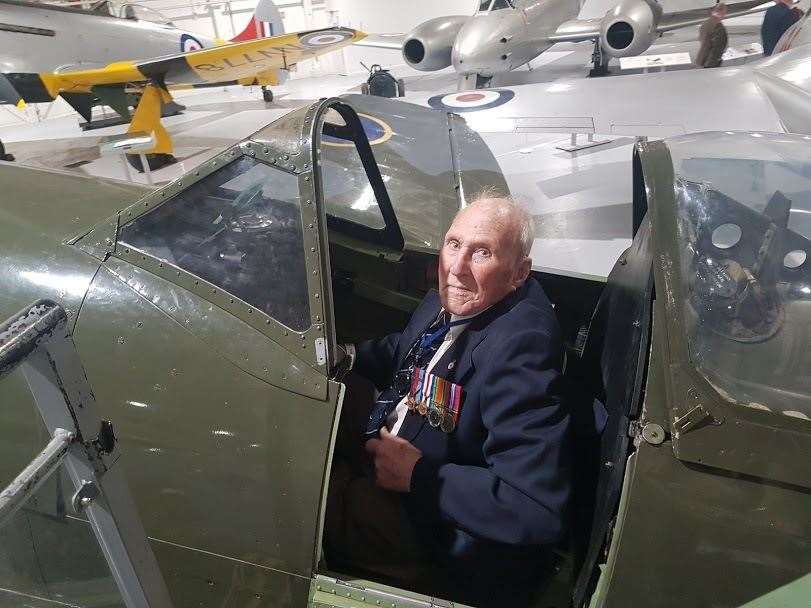 Henry had a twinkle in his eye when he sat in the cockpit of a Spitfire for the first time in his life. (42933800)