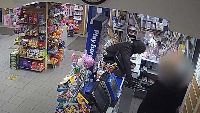 Police have released footage of a man with a knife raiding Gedney Newsagents in Long Sutton on March 29 PHOTO: SUPPLIED BY LINCOLNSHIRE POLICE