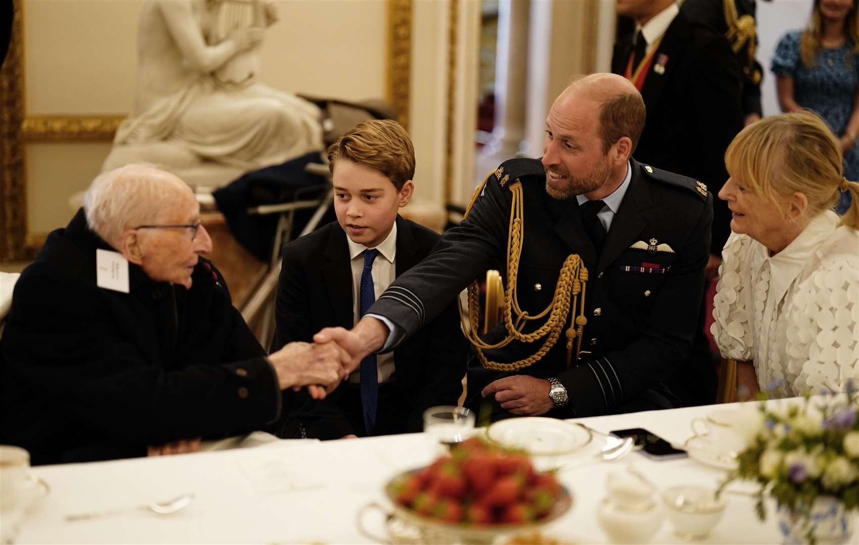 William and George join Second World War veterans at the tea party (Jordan Pettitt/PA)